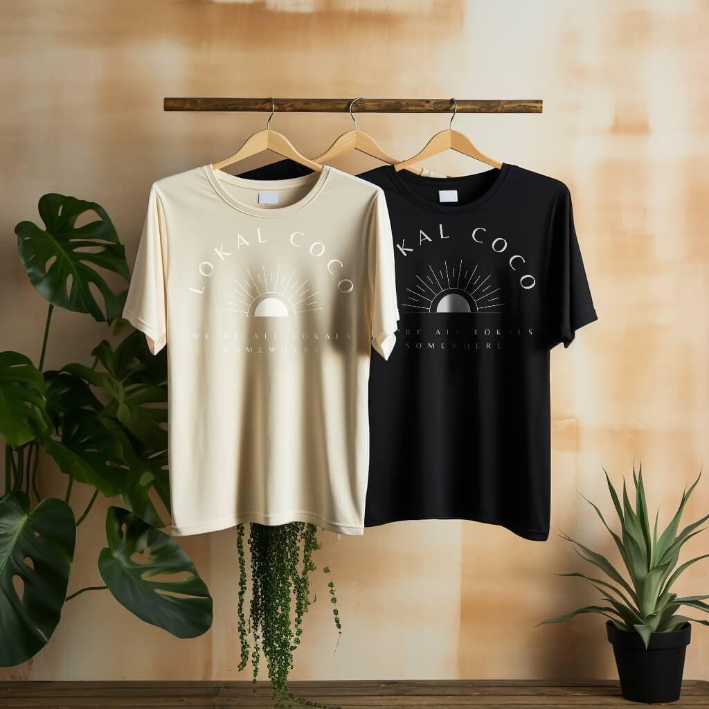 Two Lokal Coco shirts hanging on a rack